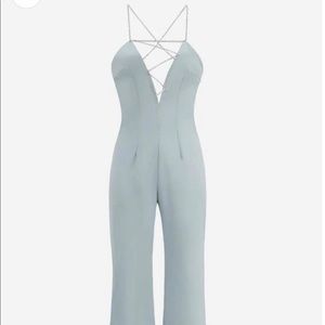 Light blue jumpsuit with diamond strap detail
